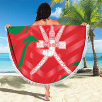 Red round beach blanket with white fringe, Oman crest design and custom text