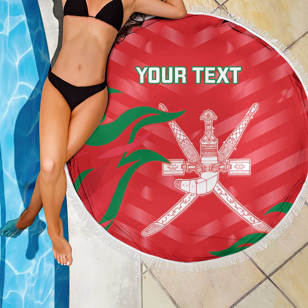 Red circular beach blanket with white fringe, Oman emblem and custom text print