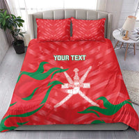 Red duvet and two red pillowcases with green waving flag design and crossed swords emblem.
