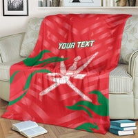 Red custom cricket blanket on armchair with green flag stripes and crossed swords emblem