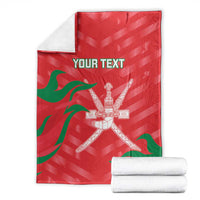 Red custom cricket blanket folded with green stripes and crossed swords emblem, 'YOUR TEXT'