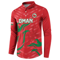 Red button-front sweatshirt with Oman emblem, OMAN text, and green wave flag print