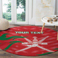 Red round area rug with green wave accents and white central cross design