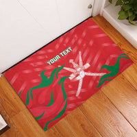 Red rubber cricket doormat with green waves and white emblem, 'YOUR TEXT' across