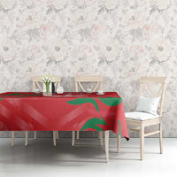 Red cricket tablecloth with green flame pattern on long dining table