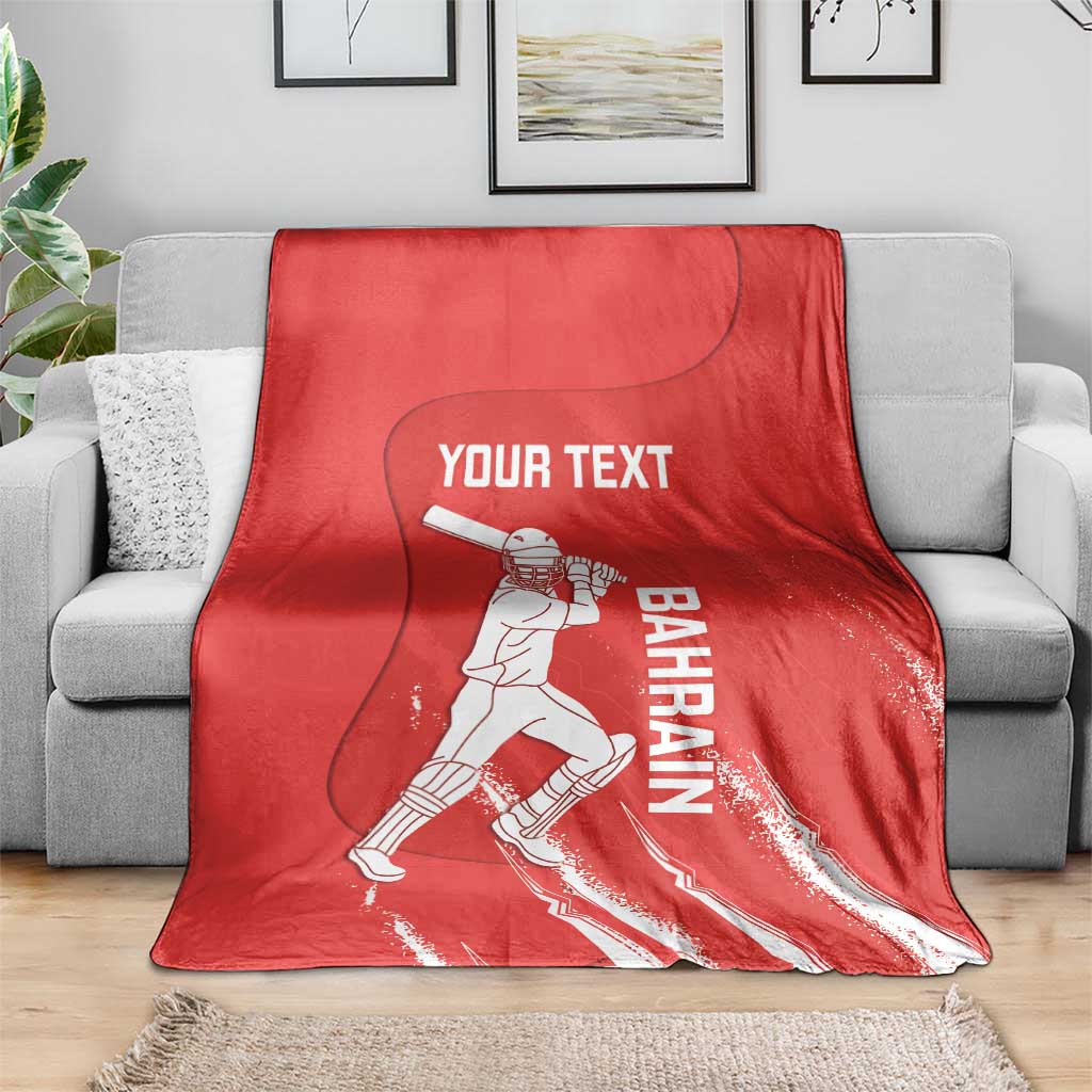Red cricket blanket with Bahrain player graphic and Your Text, spread over gray sofa