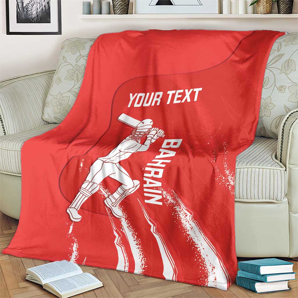 Red cricket blanket with Bahrain player graphic and Your Text print, folded on couch
