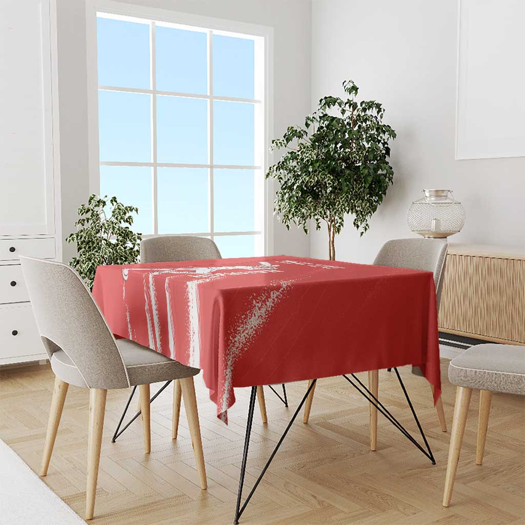 Red cricket tablecloth with white distressed stripe pattern and draped table coverage