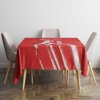 Red cricket tablecloth with central logo text and white vertical stripe accents