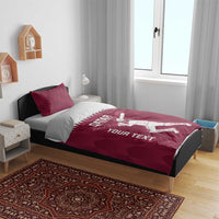 Maroon duvet cover and pillowcases set with Qatar text and cricket player graphic