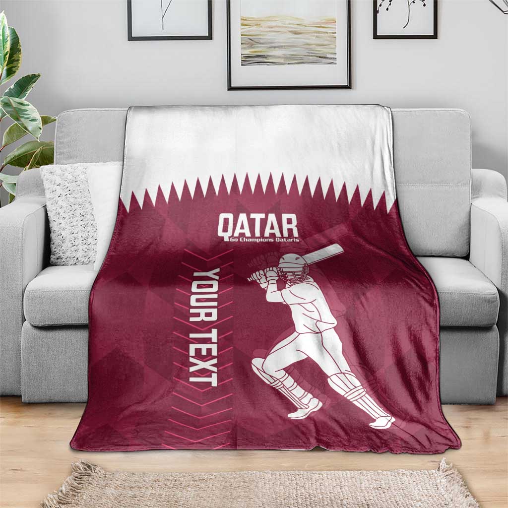 Maroon Qatar cricket blanket on a sofa, featuring player graphic and “YOUR NEXT”