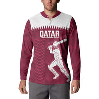 Maroon and white Qatar button sweatshirt on model, front player graphic and QATAR logo