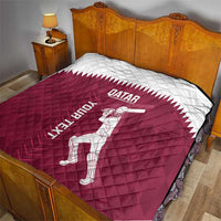Qatar cricket quilt on bed, maroon center with white logo, batsman graphic, and diamond quilting