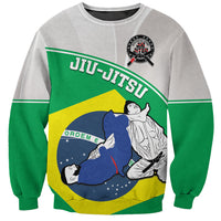 Green and gray sweatshirt with Brazil Jiu-Jitsu graphic of grappling fighters.