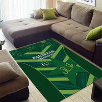 Green Pakistan Shaheens area rug with large text logo and patterned blocks
