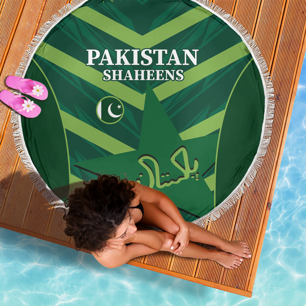 Green round beach blanket with Pakistan Shaheens text and crescent star emblem, white fringe