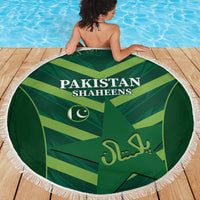 Green round Pakistan Shaheens beach blanket with bold text and white fringe border