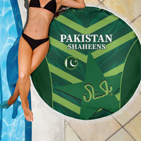 Green round beach blanket with Pakistan Shaheens headline and white fringe edge
