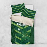 Green bedding set flat lay with Pakistan Shaheens duvet and chevron pillowcases