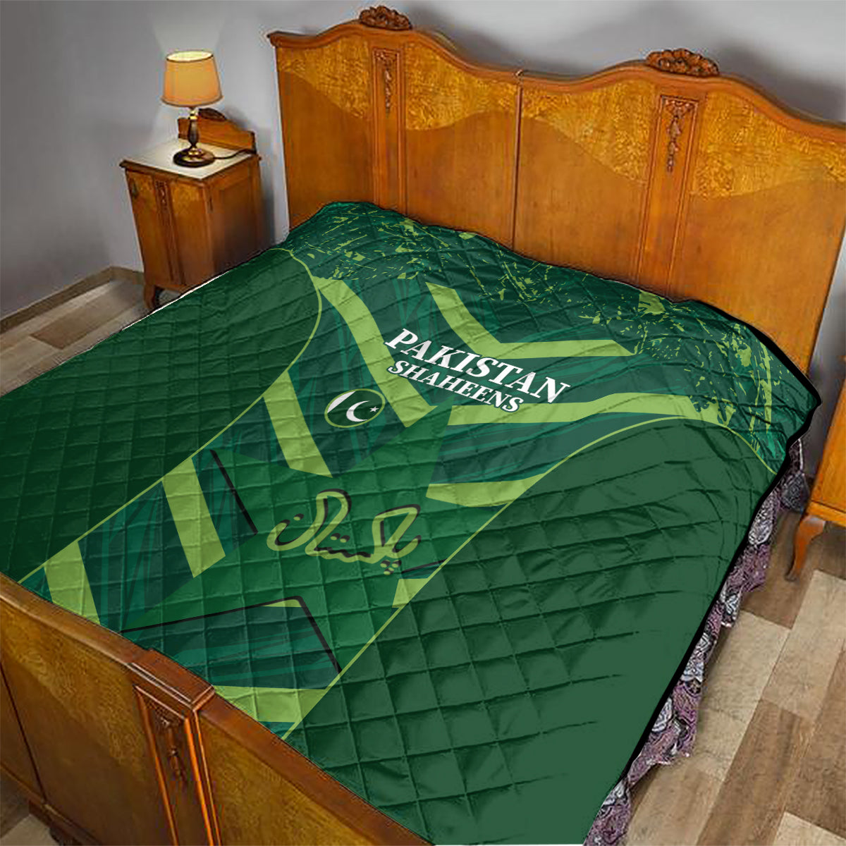 Green Pakistan Shaheens quilt on a bed with wooden headboard