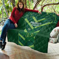 Green Pakistan Shaheens quilt spread out on an outdoor sofa