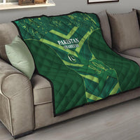 Green Pakistan Shaheens quilt on a living room sofa