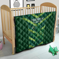 Green Pakistan Shaheens quilt on a baby bed, quilted diamond design