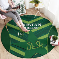 Green round carpet with Pakistan Shaheens logo and crescent, calligraphy center graphic