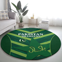Green round carpet with Pakistan Shaheens logo and crescent on star pattern
