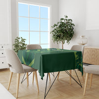 Green tablecloth on dining table with Pakistan Shaheens fan pattern, rectangular cover
