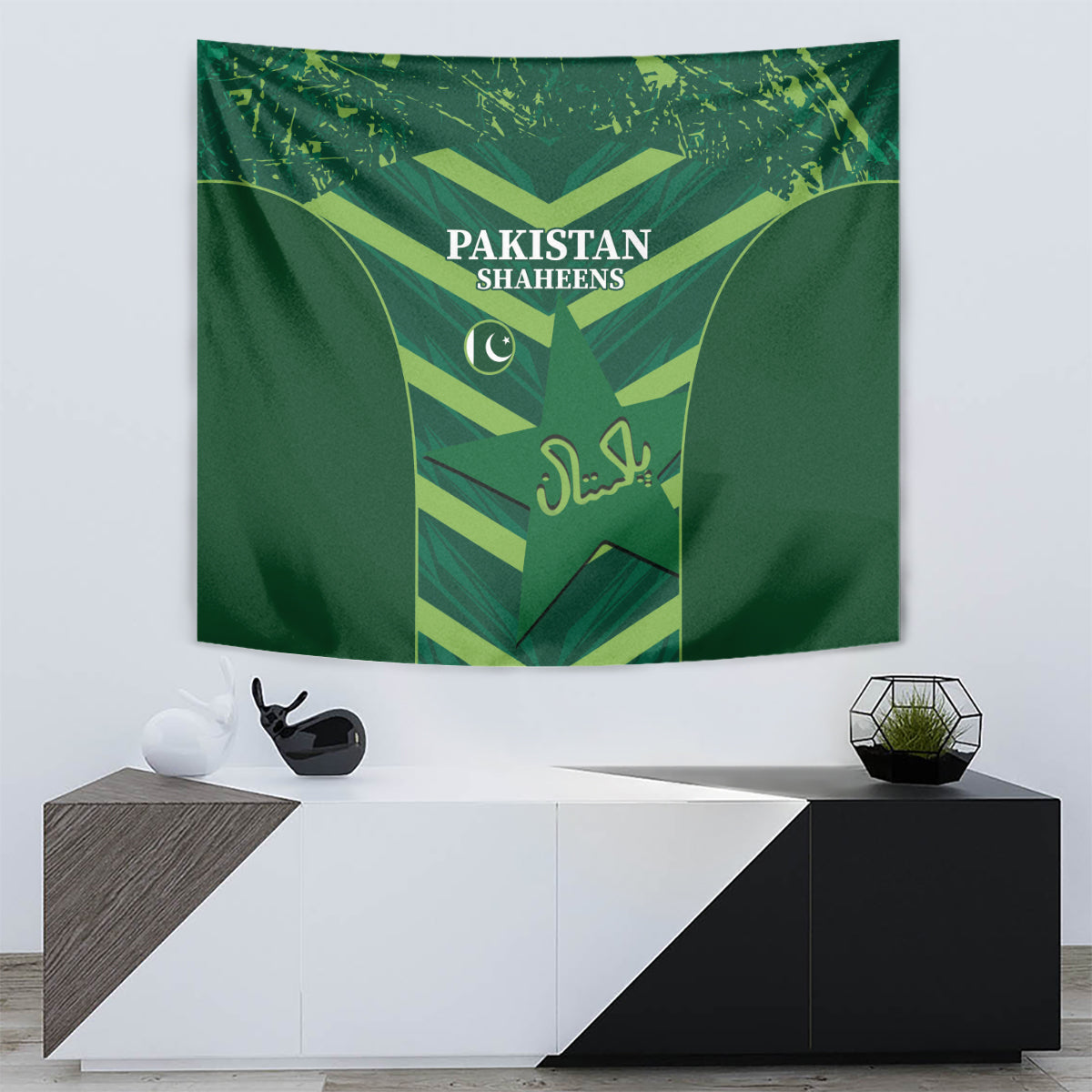 Green Pakistan Shaheens tapestry above a console with shield and crescent graphic