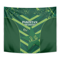 Green Pakistan Shaheens tapestry close-up with crest, crescent, and decorative Arabic text