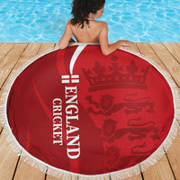 Red circular cricket beach blanket with England text and fringed white edge
