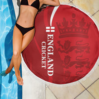 Red circular cricket beach blanket with England text, crowned lion pattern, and white fringe