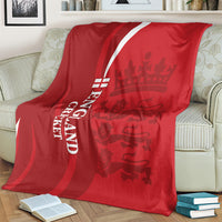 Red England cricket blanket with white diagonal stripe and vertical “ENGLAND CRICKET” text