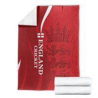 Red England cricket blanket with white “ENGLAND CRICKET” text and lion crown design, folded