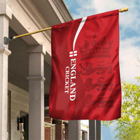 Red England cricket garden flag hanging from a brass pole on a porch