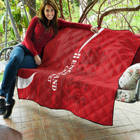 Red England cricket quilt draped on outdoor chair with white crescent and 'ENGLAND CRICKET'