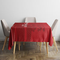 Red England cricket-themed tablecloth with dark graphic pattern, draped on round table