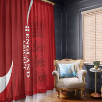 Red England cricket curtains with vertical white text and crest, room view with chair