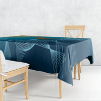 Blue cricket tablecloth with dark-to-light geometric line design, draped on table