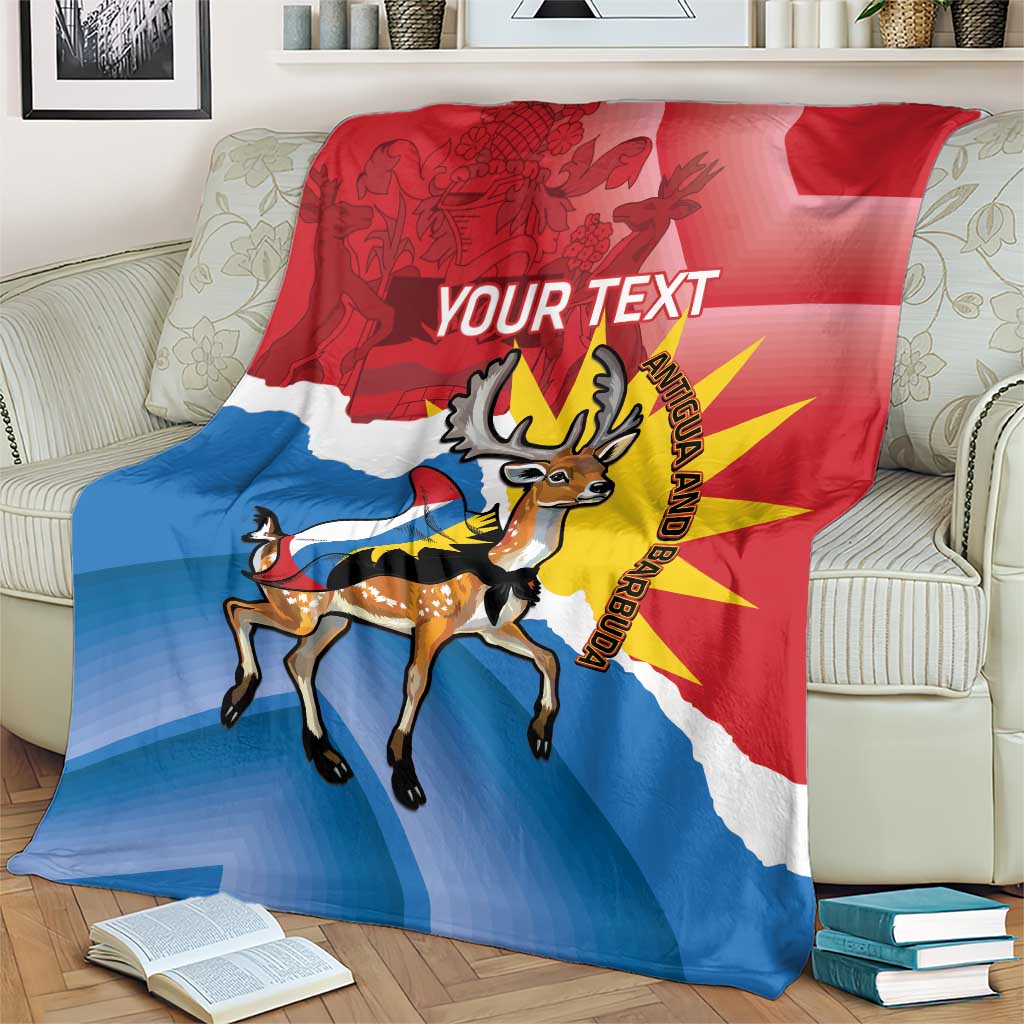 Red-blue Antigua and Barbuda blanket showing deer graphic and 'YOUR TEXT' across the middle