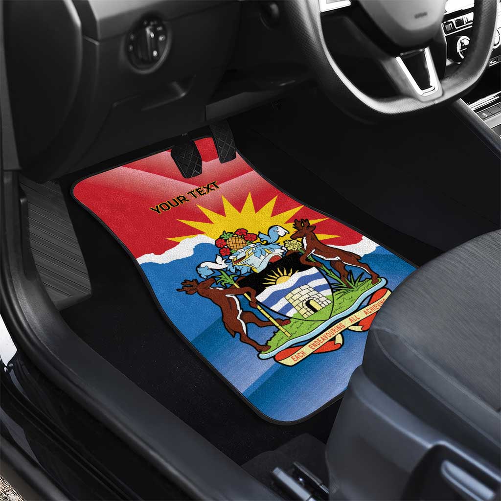 Car mat on floor in front seat with Antigua flag deer design and red 'YOUR TEXT' text