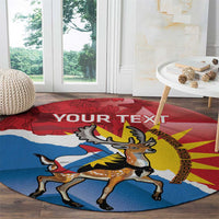 Round red rug with deer and Antigua and Barbuda flag, “YOUR TEXT” across top