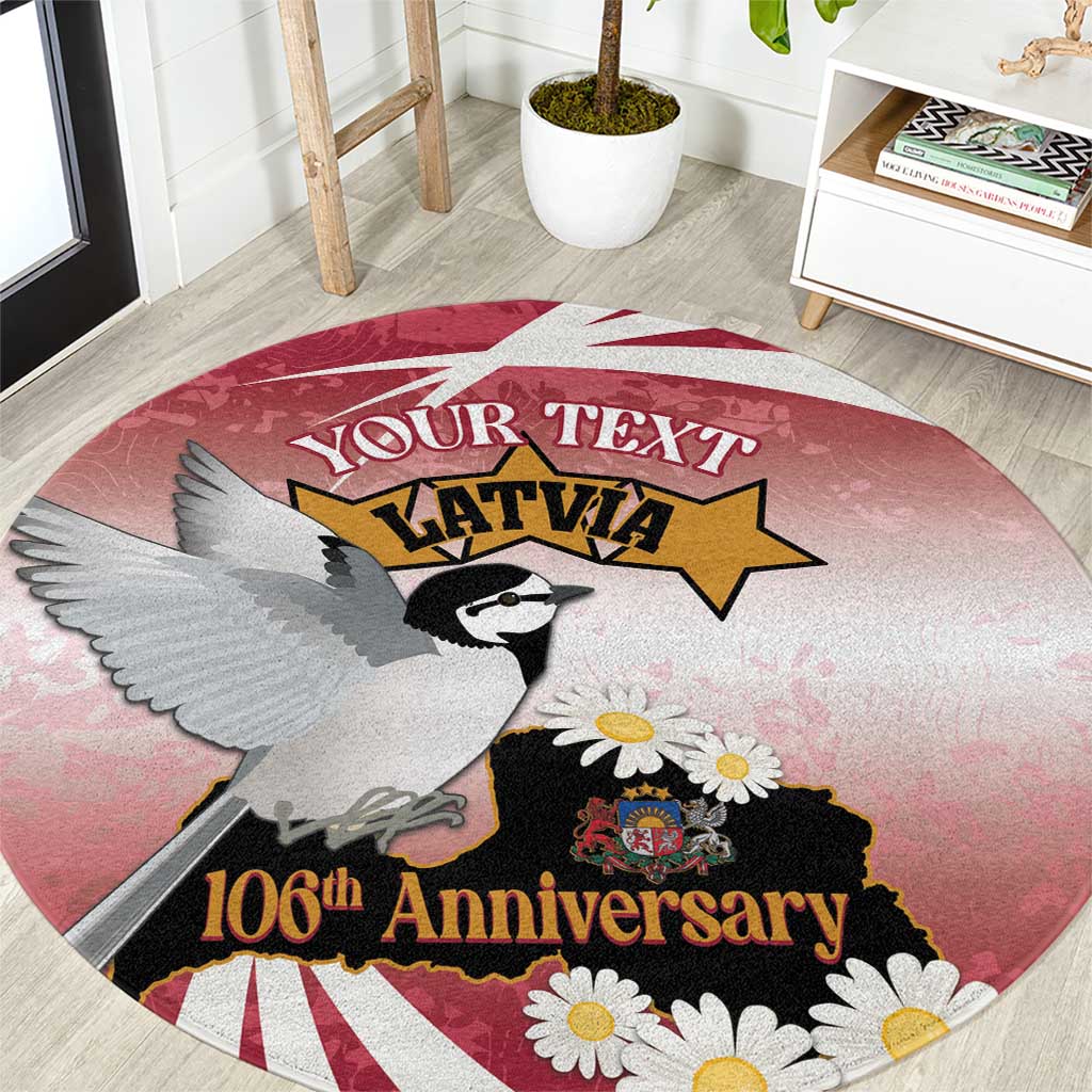 Red round carpet with gray bird, daisies, and 106th Anniversary print