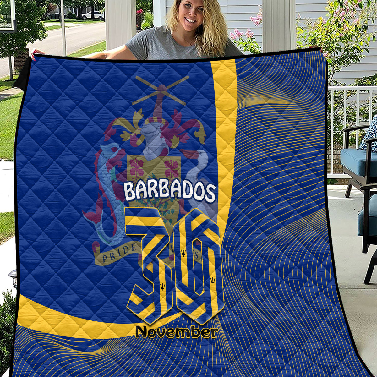 Blue Barbados quilt with yellow stripe, crest emblem, and “November” text