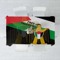 Black tablecloth with Palestinian flag-style coat of arms and “Free Palestine” text print