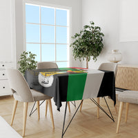 Tablecloth with black, green, and white flag-style coat of arms print