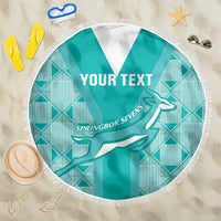 Round teal rugby beach blanket with white fringe, Springbok Sevens graphic and “YOUR TEXT”.