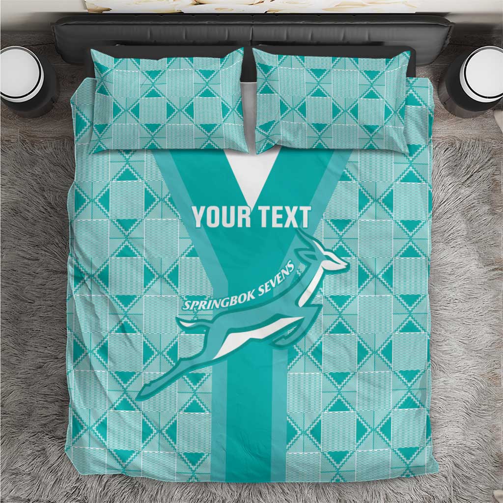 Teal patterned rugby bedding set with white stripe center and two matching pillows